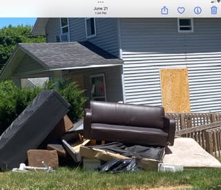 Belongings at a home in the 1300 block of Otto St. owned by Christian Nwobu after the property was red-tagged. (Courtesy Leslie Arnett. WLNS)