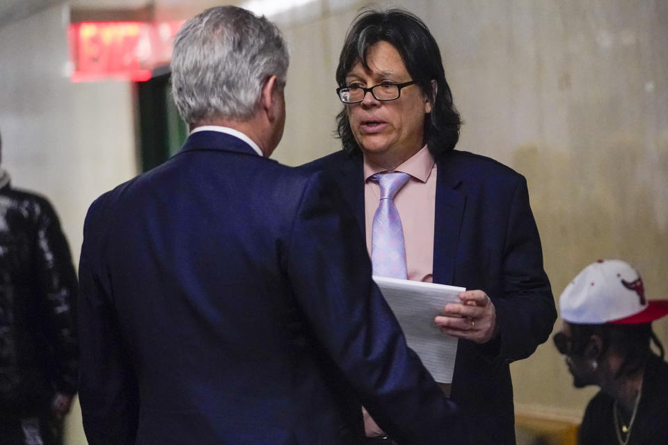 Memorabilia seller Edward Kosinski, right, is seen in the hallway of the supreme court, Wednesday, Feb. 21, 2024, in New York. A criminal case involving handwritten lyrics to the classic rock megahit “Hotel California” and other Eagles favorites went to trial Wednesday in New York, with three men accused of scheming to thwart band co-founder Don Henley’s efforts to reclaim the allegedly ill-gotten documents. (AP Photo/Mary Altaffer)