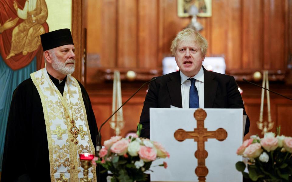 Boris Johnson attends a meeting with members of the Ukrainian community at the Ukrainian Catholic Cathedral in London on Sunday - POOL/REUTERS