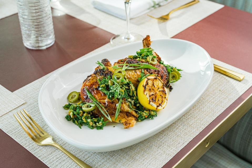 Mojo-marinated roasted chicken is on the menu at The House, a new restaurant with golf course views in West Palm Beach.