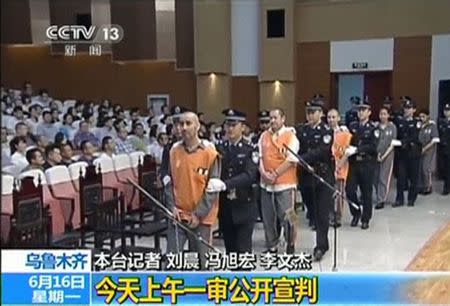 The trial of three people sentenced to death for their roles in an October attack on the edge of Beijing's Tiananmen Square is seen in this still image taken from video in Urumqi city, June 16, 2014. REUTERS/CCTV/via Reuters TV
