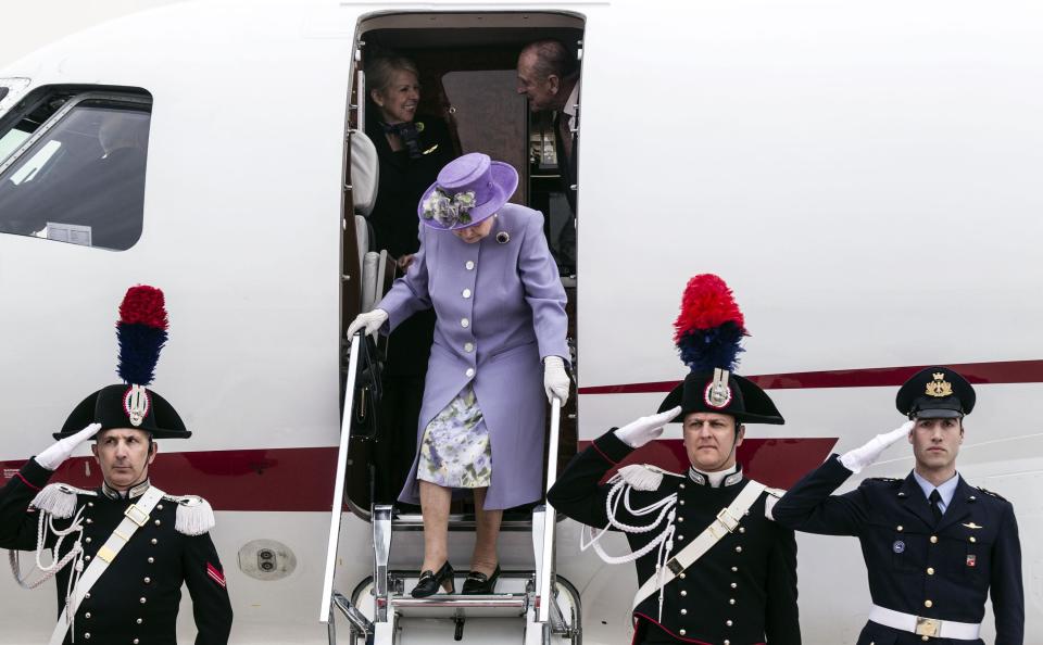 Queen Elizabeth II arrives at Rome's Ciampino military airport to start a one-day visit to Italy and the Vatican, Thursday, April 3, 2014. The British Royals will meet Italian President Giorgio Napolitano during an official lunch at the Quirinale Presidential Palace and Pope Francis at the Vatican in the afternoon. (AP Photo/Angelo Carconi, pool)