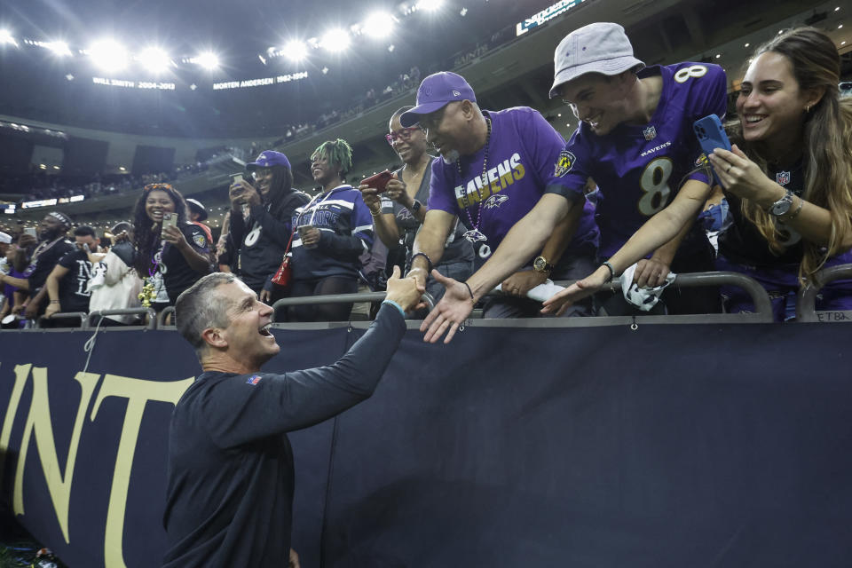 Baltimore Ravens head coach John Harbaugh greets fans after an NFL football game against the New Orleans Saints in New Orleans, Monday, Nov. 7, 2022. The Ravens won 27-13. (AP Photo/Butch Dill)