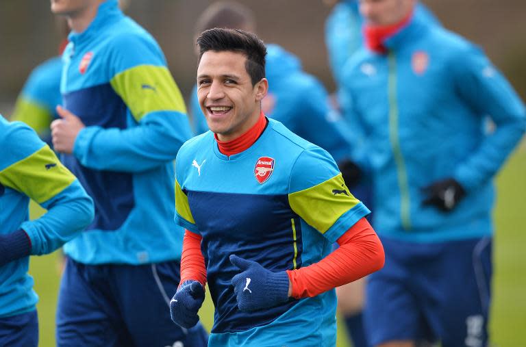 Arsenal's Alexis Sanchez attends a training session with teammates, at Arsenal's training ground in London Colney, north of London, on February 24, 2015