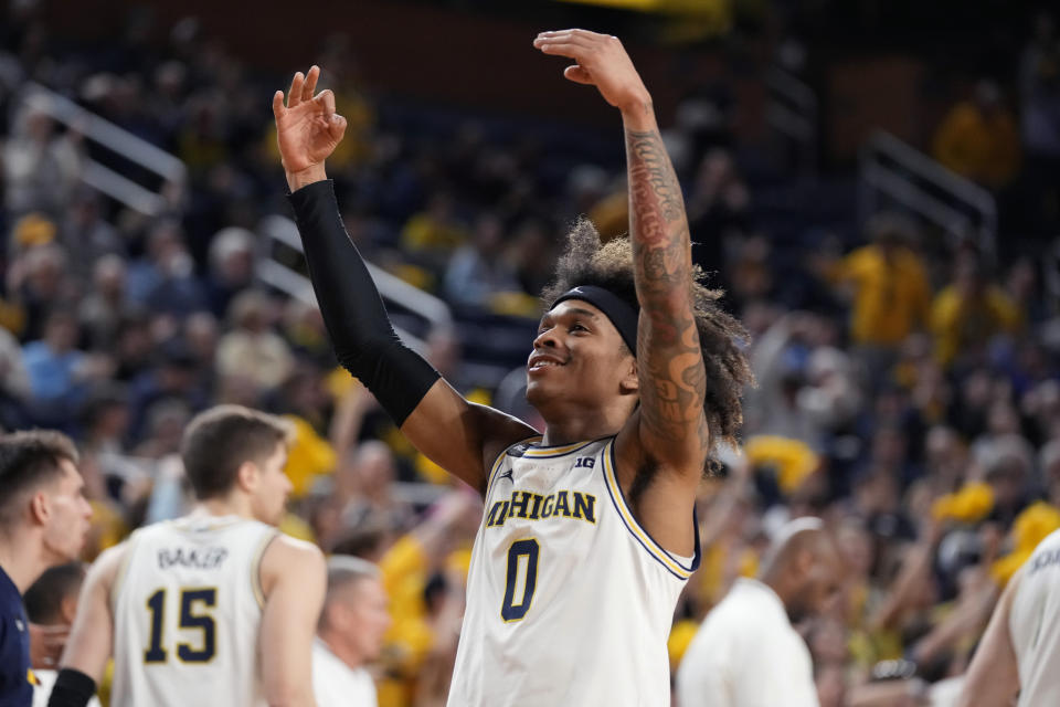 Michigan guard Dug McDaniel (0) reacts after a play during the first half of an NCAA college basketball game against Nebraska, Wednesday, Feb. 8, 2023, in Ann Arbor, Mich. (AP Photo/Carlos Osorio)