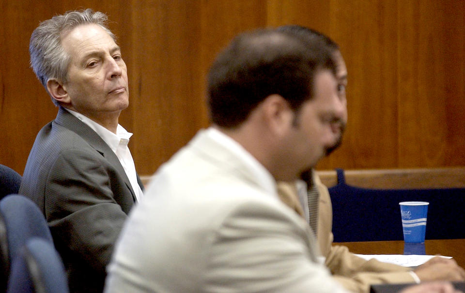 Robert Durst, left, sits in a courtroom during a pre-trial hearing at the Galveston County Courthouse in Galveston, Texas on Aug. 18, 2003. (Kevin Bartram / Galveston County Daily News via AP file)