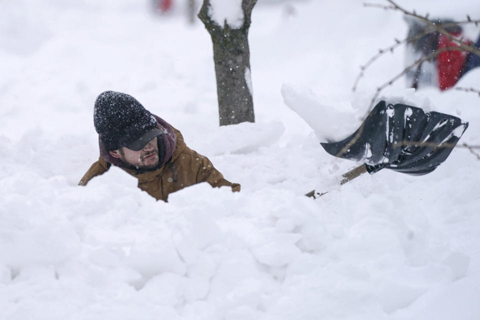 Tommy Roetzer digs out his driveway on West Delavan Street in Buffalo, N.Y., on Monday, Dec. 26, 2022. (Derek Gee / AP)