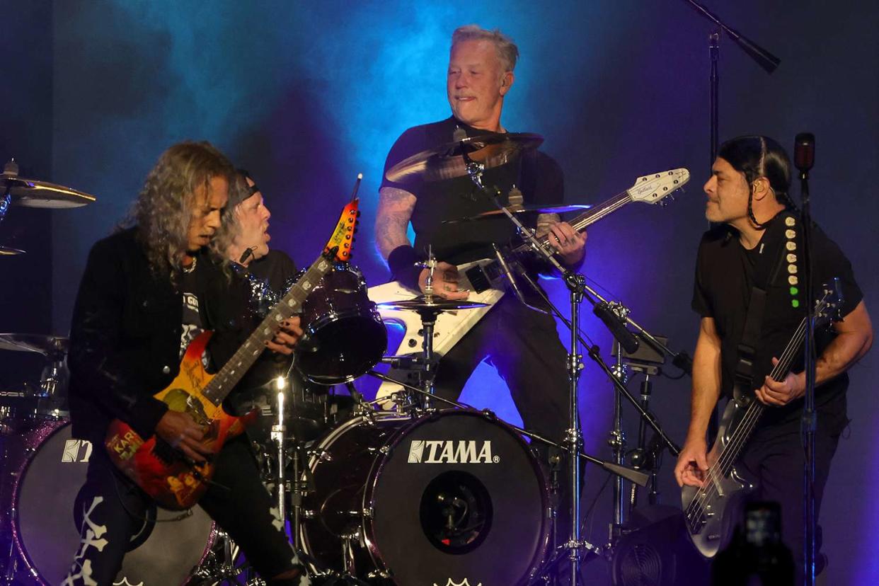 <p>Ethan Miller/Getty</p> Kirk Hammett, Lars Urich, James Hetfield, and Robert Trujillo of Metallica performing in Las Vegas in 2022