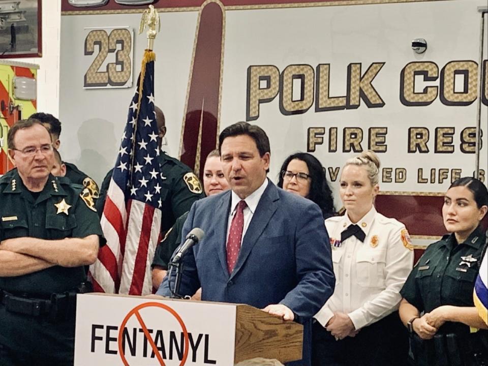 Gov. Ron DeSantis, center, signed HB Bill 95 Thursday afternoon at Polk County Fire Rescue Station 23 in Lakeland. The legislation will increase the penalty for trafficking methamphetamines, including fentanyl, to first-degree felony murder and raises the minimum mandatory sentence.