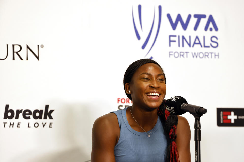 Coco Gauff, of the United States, laughs during a press conference at the WTA Finals tennis tournament in Fort Worth, Texas, Saturday, Oct. 29, 2022. (AP Photo/Ron Jenkins)