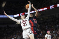 Mississippi forward Madison Scott (24) scores over South Carolina forward Chloe Kitts (21) during the first half of an NCAA college basketball game Sunday, Feb. 4, 2024, in Columbia, S.C. (AP Photo/Artie Walker Jr.)