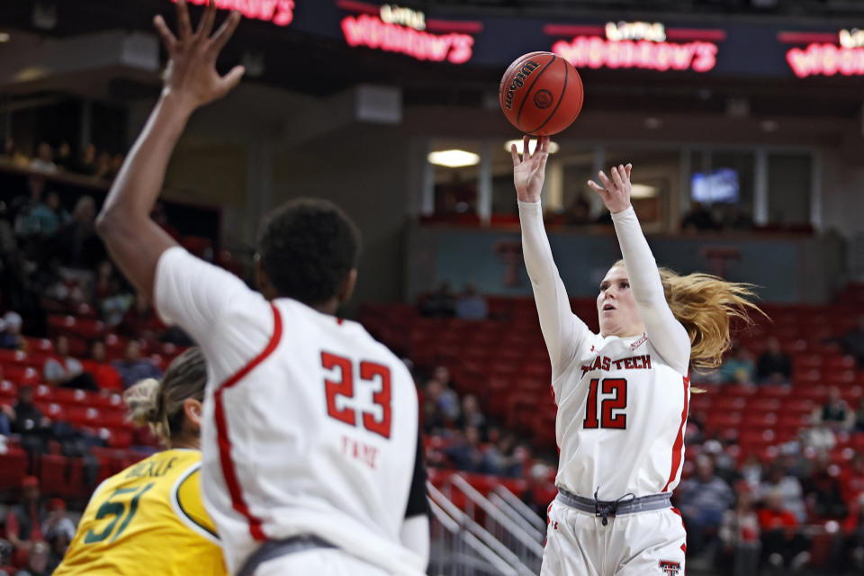 Texas Tech's Vivian Gray (12) shoots the ball during the first half of an NCAA college basketball game against Baylor, Wednesday, Jan. 26, 2022, in Lubbock, Texas. (AP Photo/Brad Tollefson)