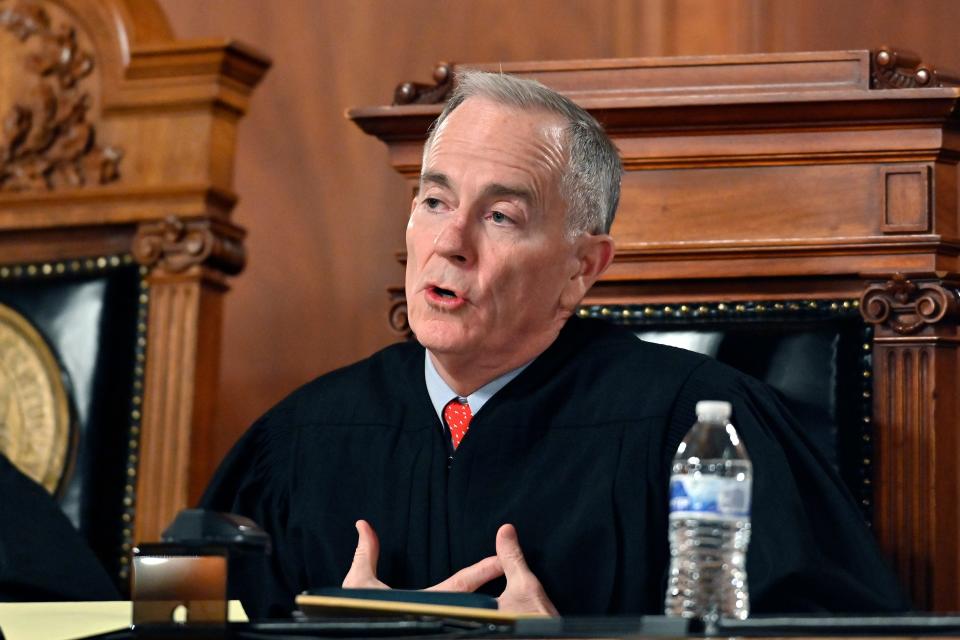 Kentucky Supreme Court Justice Lawrence VanMeter asks a question to Kentucky Solicitor General as they hear arguments whether to temporarily pause the state's abortion ban in Frankfort, Ky., Tuesday, Nov. 15, 2022. (AP Photo/Timothy D. Easley)