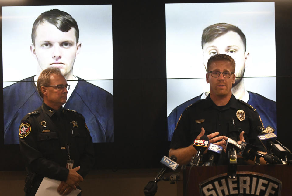 Capt. Dan Baumann of the Waukesha Police Department, right, addresses the media with Kenosha County Sheriff David Beth during a news conference in Kenosha Wednesday, Sept. 11, 2019. (Paul Williams/The Kenosha News via AP)