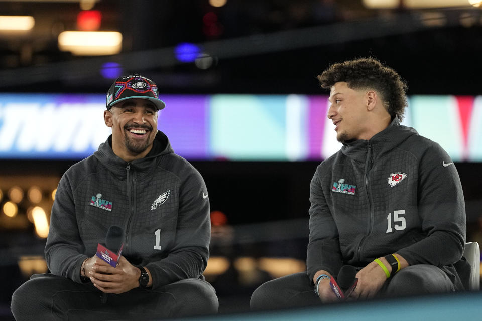 Kansas City Chiefs quarterback Patrick Mahomes, right, and Philadelphia Eagles quarterback Jalen Hurts speak to the media ahead of Super Bowl LVII. (AP Photo/David J. Philip)