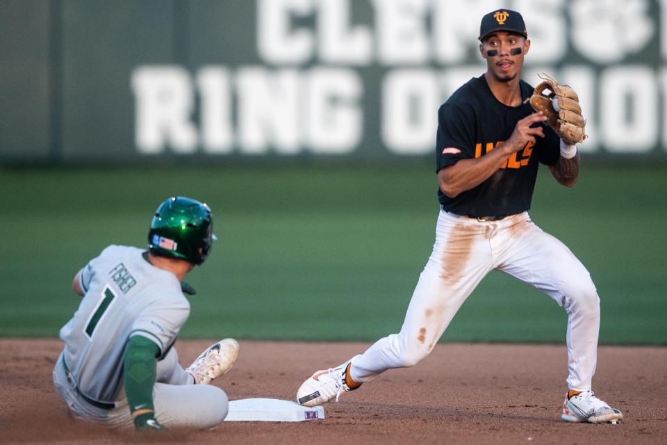 Tennessee infielder Maui Ahuna (2) tags Charlotte’s Cam Fisher (1) out at second during a NCAA baseball regional game between Tennessee and Charlotte held at Doug Kingsmore Stadium in Clemson, S.C., on Friday, June 2, 2023. © Brianna Paciorka/News Sentinel / USA TODAY NETWORK