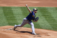 Milwaukee Brewers starting pitcher Brandon Woodruff throws the ball during the first inning of a baseball game against the Milwaukee Brewers, Thursday, May 6, 2021, in Philadelphia. (AP Photo/Derik Hamilton)