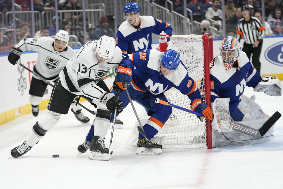 Los Angeles Kings right wing Gabriel Vilardi (13) skates against New York Islanders defenseman Sebastian Aho (25) during the first period of an NHL hockey game Friday, Feb. 24, 2023, in Elmont, N.Y. (AP Photo/Mary Altaffer)