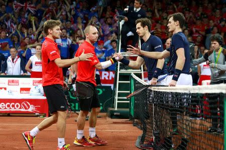 Tennis - Belgium v Great Britain - Davis Cup Final - Flanders Expo, Ghent, Belgium - 28/11/15 Men's Doubles - Great Britain's Andy Murray and Jamie Murray shake hands with Belgium's Steve Darcis and David Goffin after winning their match Action Images via Reuters / Jason Cairnduff Livepic