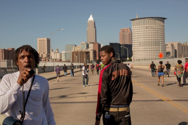 Protestors march across the Detroit Superior Bridge as people take to the streets after Cleveland police officer Michael Brelo was acquitted of manslaughter charges