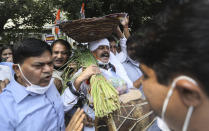 Members of India's opposition Congress party shout anti government slogans during a protest against farm bills in New Delhi, India, Monday, Sept. 21, 2020. Amid an uproar in Parliament, Indian lawmakers on Sunday approved a pair of controversial agriculture bills that the government says will boost growth in the farming sector through private investments. (AP Photo/Manish Swarup)