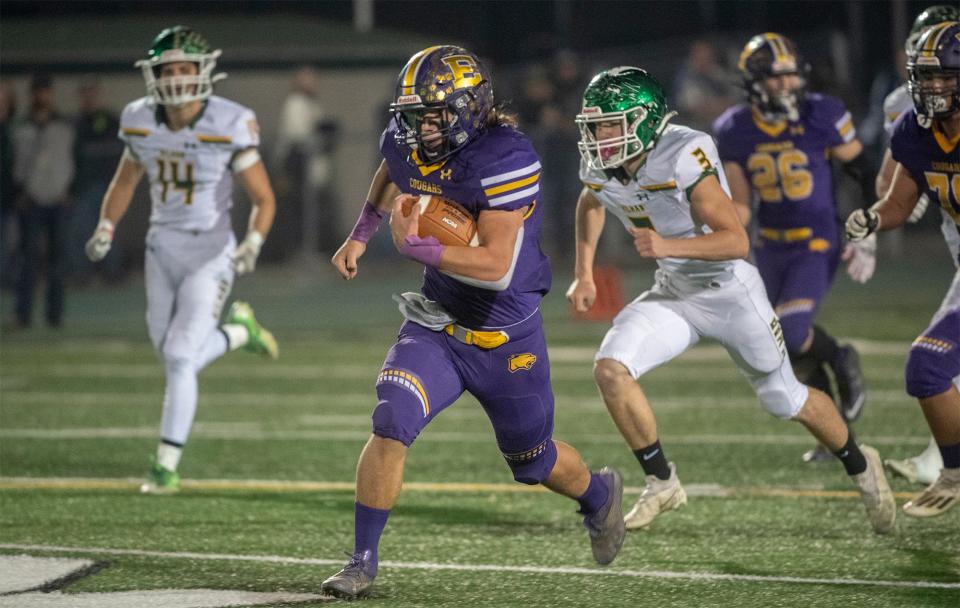 Escalon's Ryker Peters breaks away for the pack on his way to a touchdown during the Sac-Joaquin Section Division V championship game against Hilmar at St. Mary's High School in Stockton. 