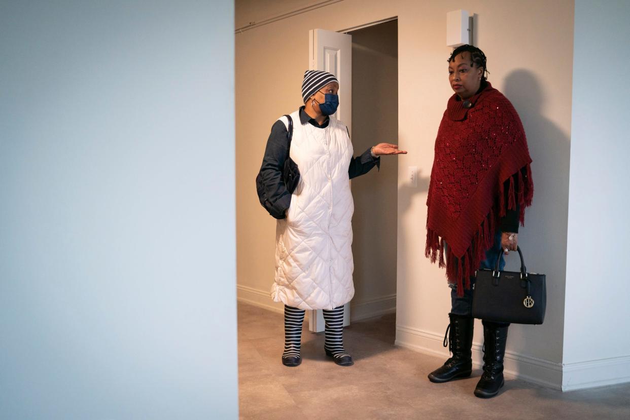 Nicole Cloyd, Community and Home Supports case manager, left, talks with a client Tonya Hogan, 49, while viewing a studio apartment at the Cathedral Tower Apartments in Detroit, Tuesday, Jan. 17, 2023. Hogan decided the space was too small for both herself and her dog. "Well, just think about it," Cloyd encouraged her.