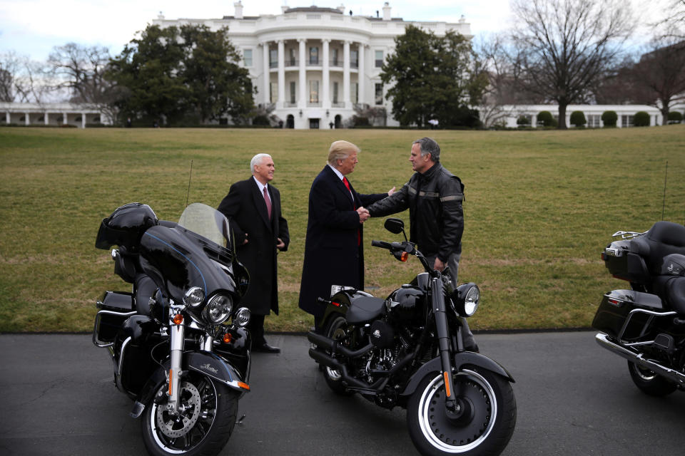 U.S. President Donald Trump shakes hands with Matthew S Levatich, CEO of Harley Davidson, accompanied by Vice President Mike Pence, during a visit of the company's executives at the White House in Washington U.S., February 2, 2017. REUTERS/Carlos Barria (Photo: Carlos Barria / Reuters)