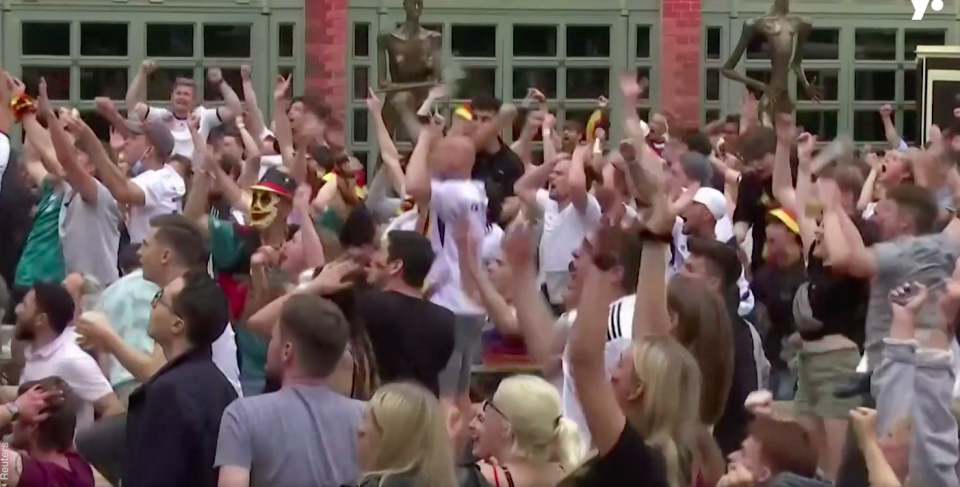 German fans celebrate what they thought was a Thomas Muller goal.