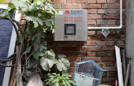 A gas meter connected with the boiler for heating in winter is pictured outside Yao family's house in Xiaozhangwan village of Tongzhou district, on the outskirts of Beijing, China June 28, 2017. Picture taken June 28, 2017. REUTERS/Jason Lee