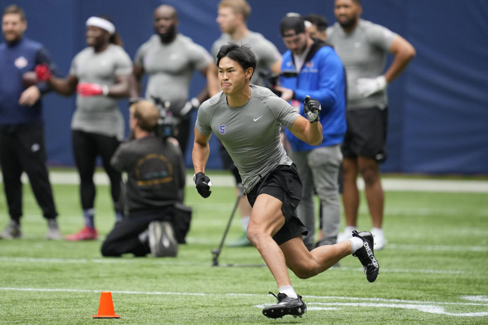 Wide receiver Riki Matsui, of Japan, takes part in the NFL International Combine at the Tottenham Hotspur Stadium in London, Tuesday, Oct. 4, 2022. International athletes on Tuesday are taking part in a series of tests in front of NFL evaluators for a potential position in the NFL's International Player Pathway programme. (AP Photo/Kin Cheung)