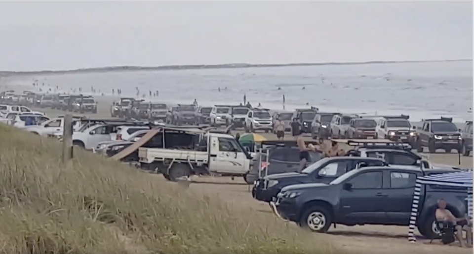 An Audi that ignored '4WD only' signs and got bogged, causing a long line of traffic on the beach. Source: Facebook