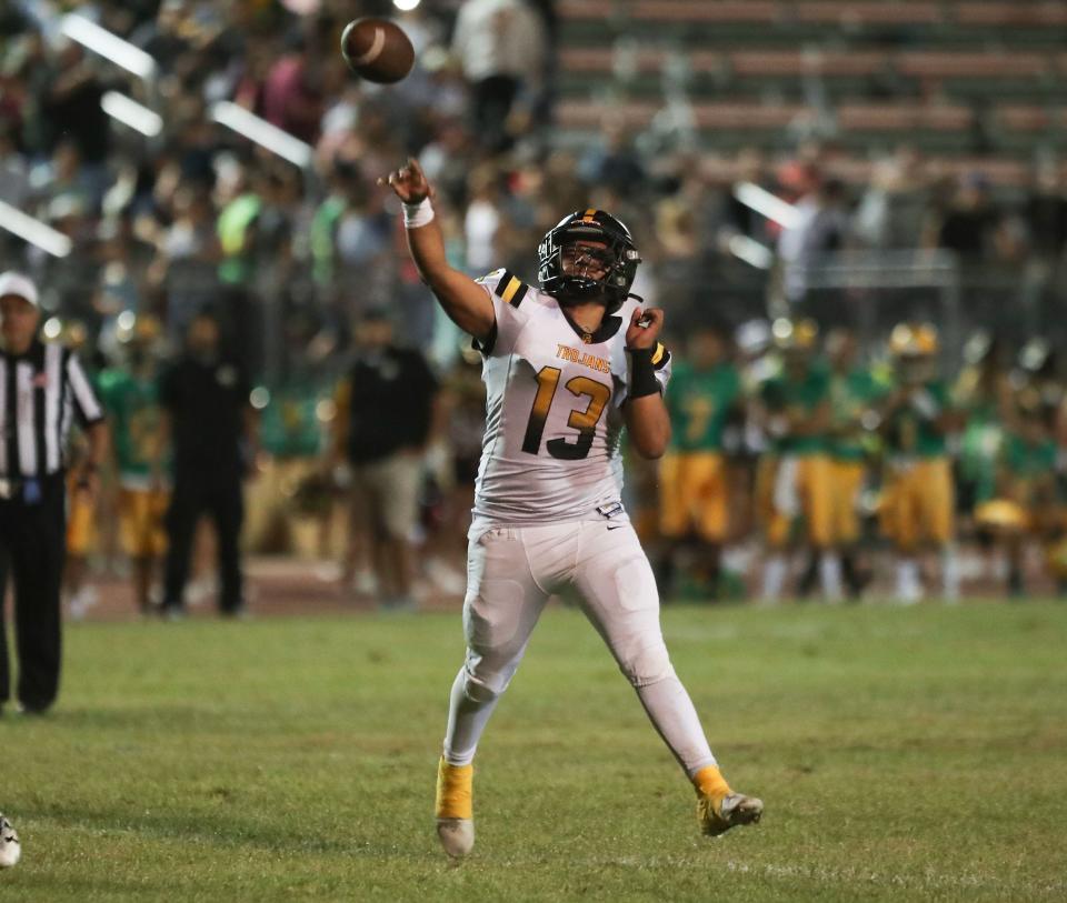 Yucca Valley quarterback Michael Ramos Jr. throws for a touchdown against Coachella Valley, Sept. 30, 2022.