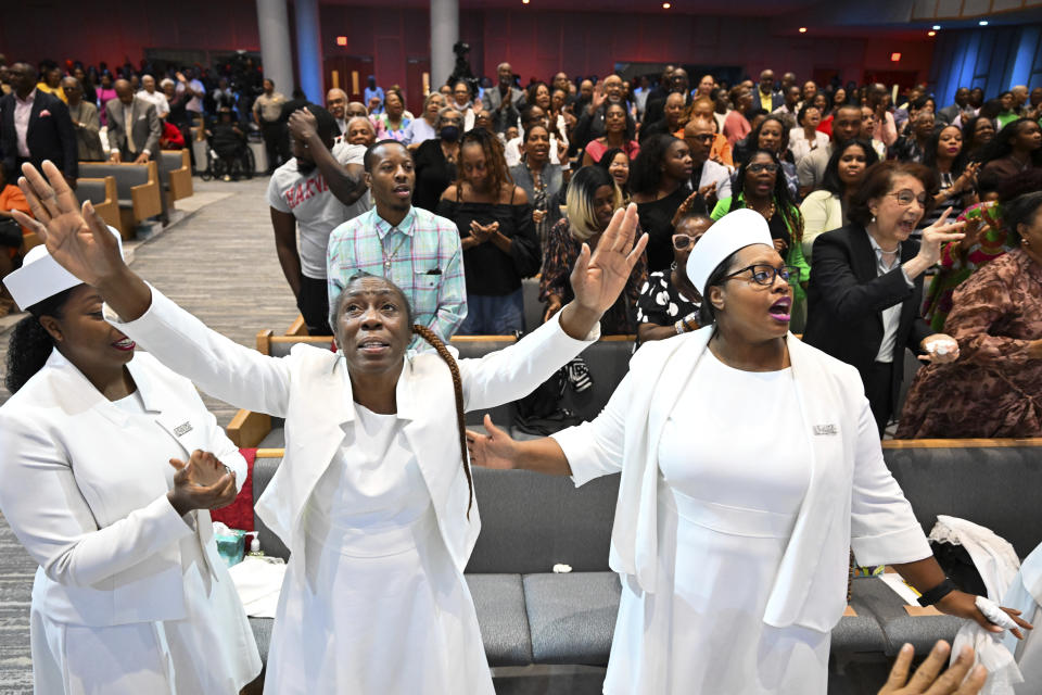 Members of the congregation at Kingdom Fellowship AME Church raise her hands in praise during church service, Sunday, June 2, 2024, in Calverton, Md. The suburban Maryland congregation, led by the Rev. Matthew L. Watley, has landed at the top of a list of the fastest-growing churches in America. (AP Photo/Terrance Williams)