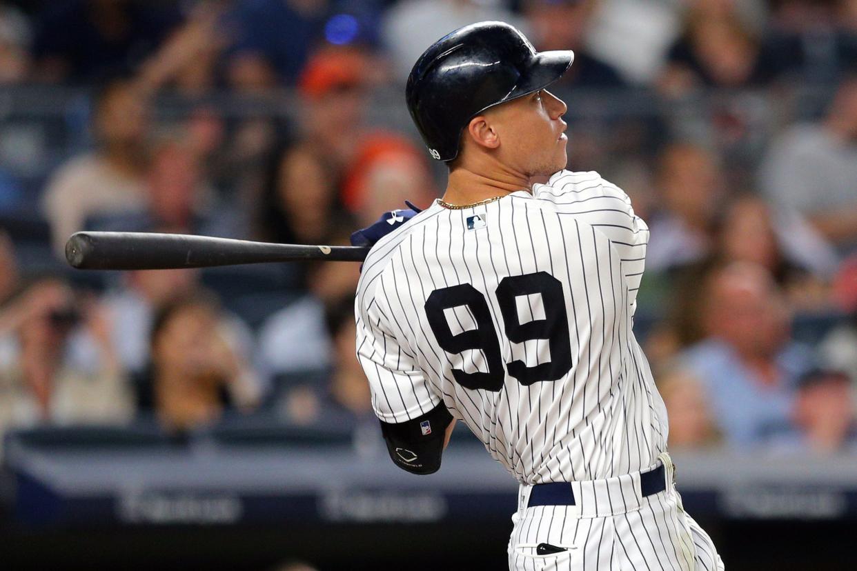 Yankees rightfielder Aaron Judge (99) follows through on a solo home run during the fifth inning of the Tigers' 7-3 loss on Monday, July 31, 2017, in New York.