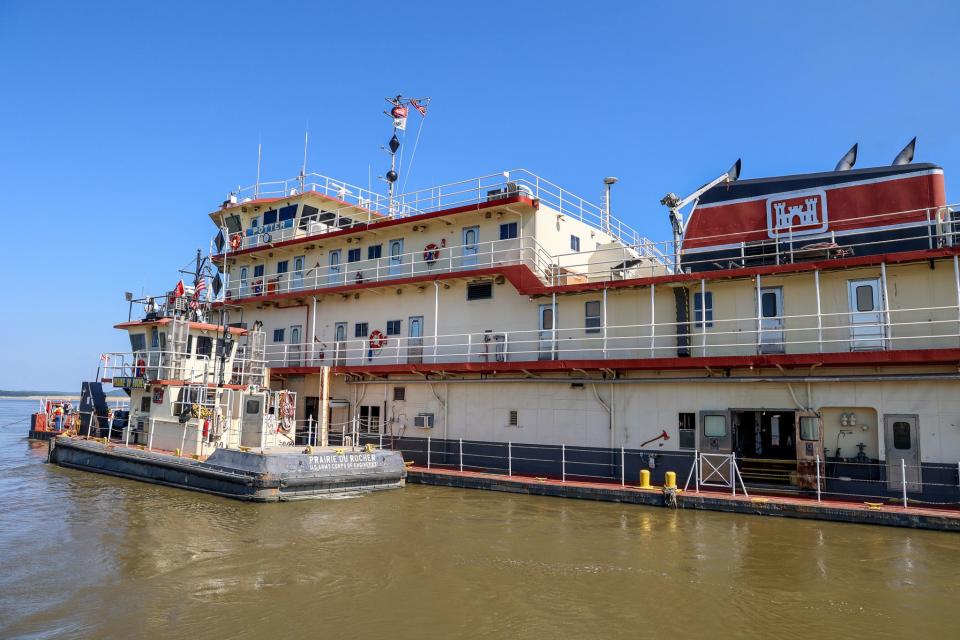 The Dredge Potter, a U.S. Army Corps of Engineers vessel, works to maintain a 9-foot-deep channel in the Mississippi River South of Chester, Illinois.