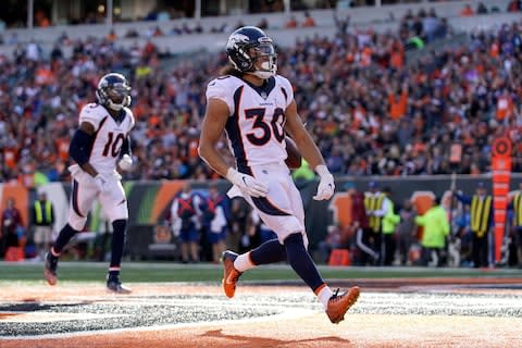 Denver Broncos running back Phillip Lindsay (30) celebrates after scoring a touchdown against the Cincinnati Bengals in the first half at Paul Brown Stadium - Credit: Aaron Doster/USA TODAY