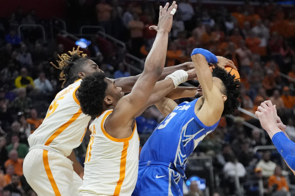 Tennessee guard Jahmai Mashack, left, and forward Tobe Awaka pressure Creighton guard Trey Alexander (23) during the second half of a Sweet 16 college basketball game in the NCAA Tournament, Friday, March 29, 2024, in Detroit. (AP Photo/Paul Sancya)