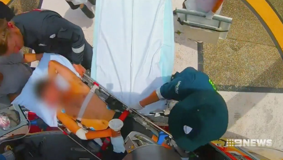 A man taken in a stretcher after a shark attack in the Whitsundays. 