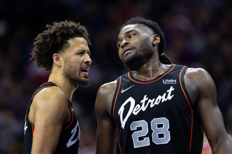 Detroit Pistons center Isaiah Stewart, right, reacts with guard Cade Cunningham after a Philadelphia 76ers score during the second quarter at Wells Fargo Center in Philadelphia on Friday, Dec. 15, 2023.