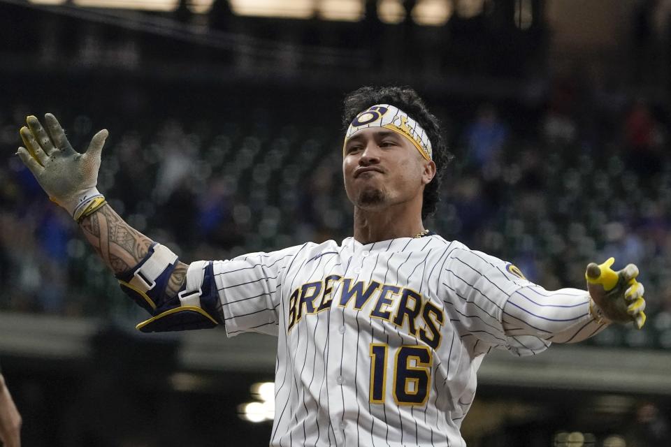 Milwaukee Brewers' Kolten Wong reacts after hitting a two-run scoring single during the eighth inning of a baseball game against the Chicago Cubs Friday, Sept. 17, 2021, in Milwaukee. (AP Photo/Morry Gash)