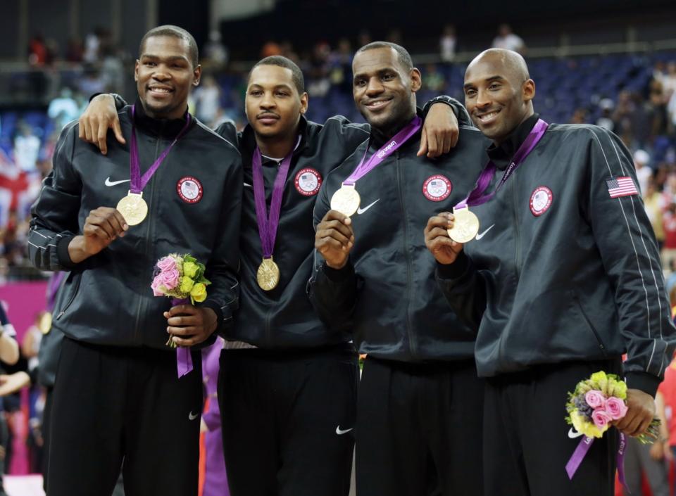 American stars (from left) Kevin Durant, Carmelo Anthony, LeBron James and Kobe Bryant celebrate after winning Olympic gold.