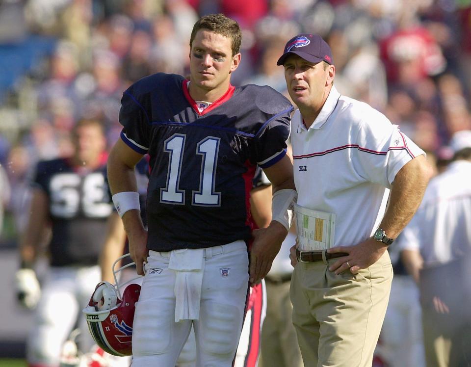 Buffalo Bills coach Mike Mularkey and quarterback Drew Bledsoe (11) await the referee's decision on the Jacksonville Jaguars' touchdown late in the fourth quarter at Ralph Wilson Stadium in Orchard Park, N.Y. on Sunday, Sept. 12, 2004. The Jaguars defeated Buffalo 13-10. (AP Photo/Don Heupel)