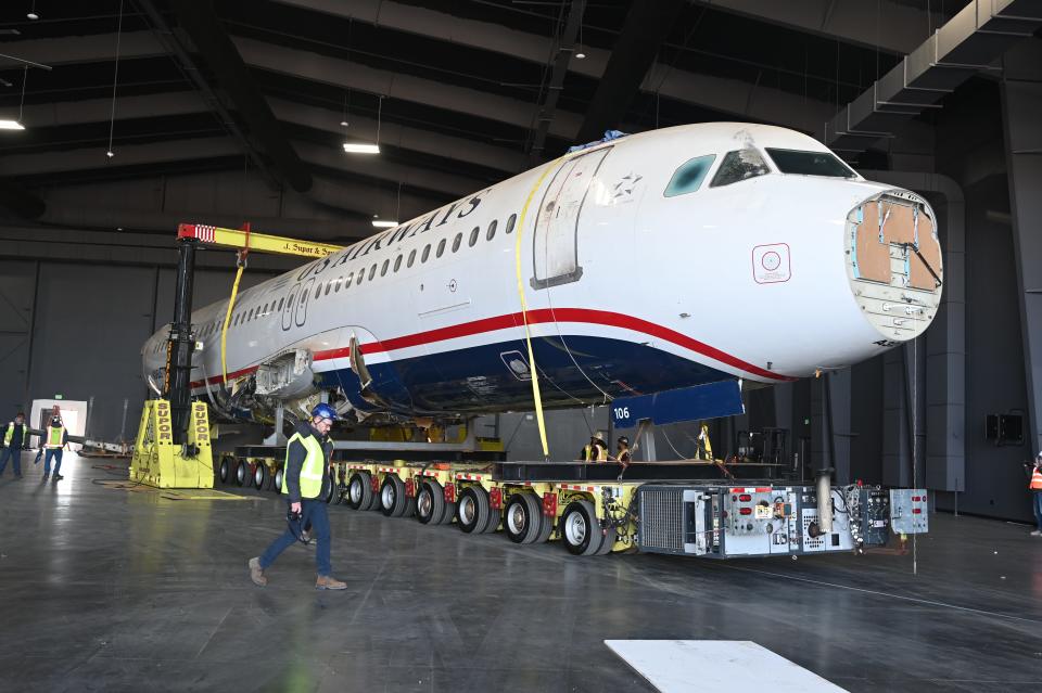 The plane being moved into the new museum.