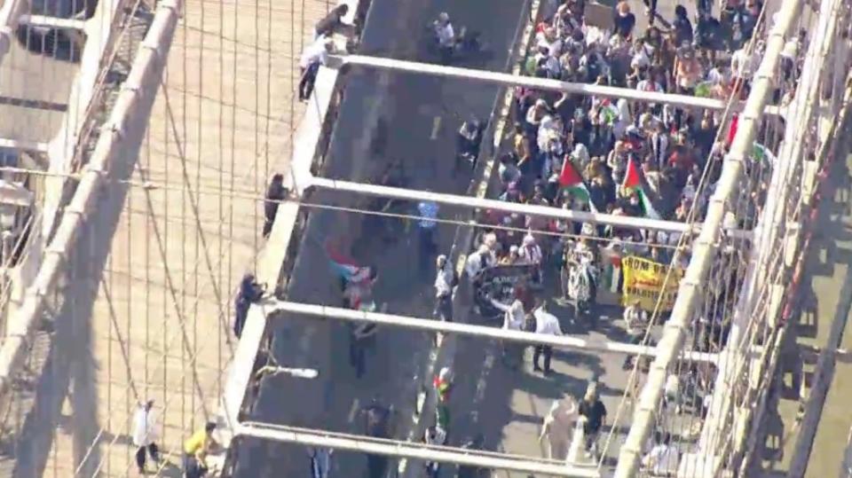 Anti-Israel protesters marching down the Brooklyn Bridge. CBS