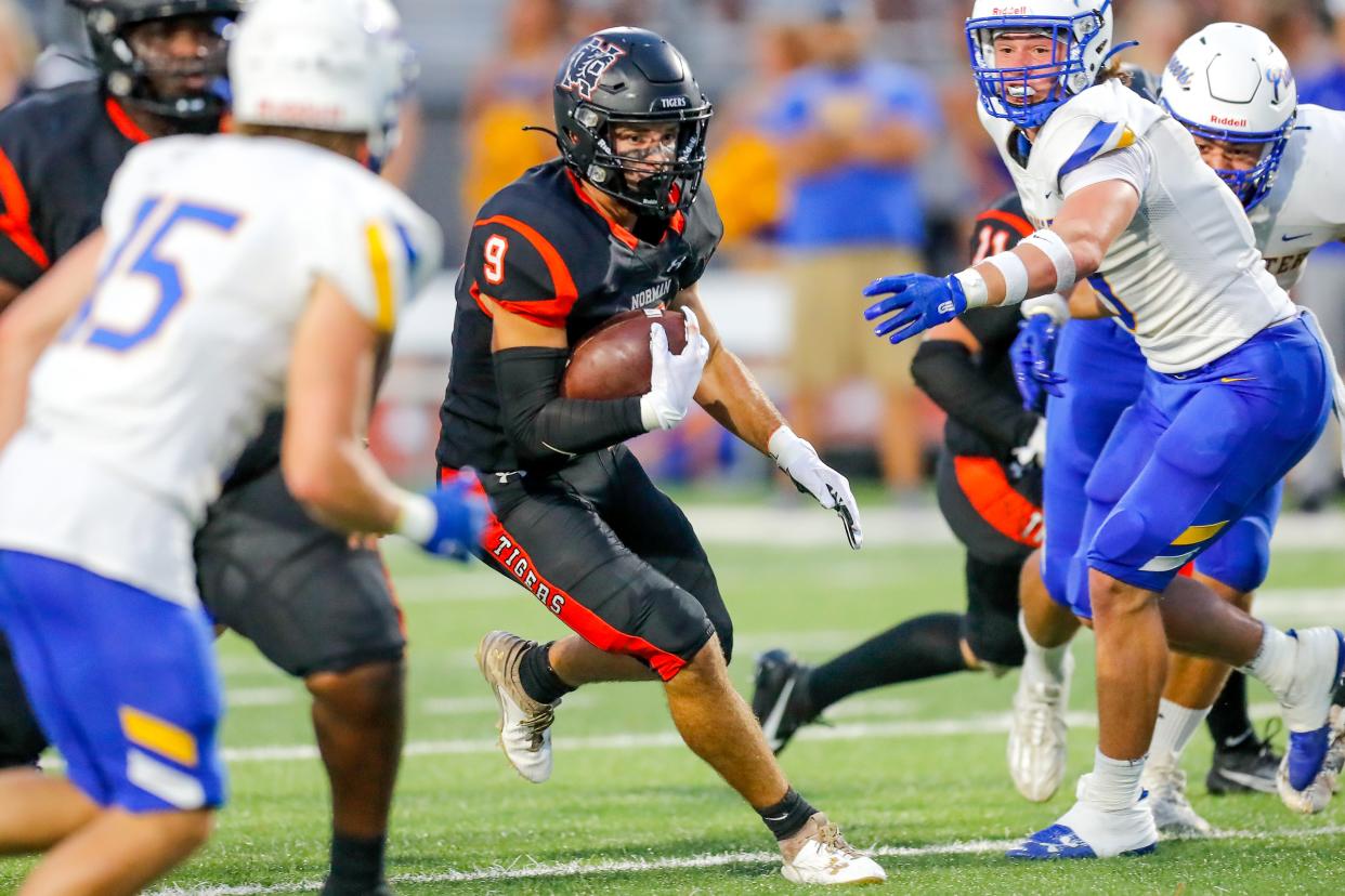 Norman’s Dax Noles (9) runs the ball during a high school football game between Stillwater High School and Norman High School in Norman, Okla., on Thursday, Sept. 14, 2023.