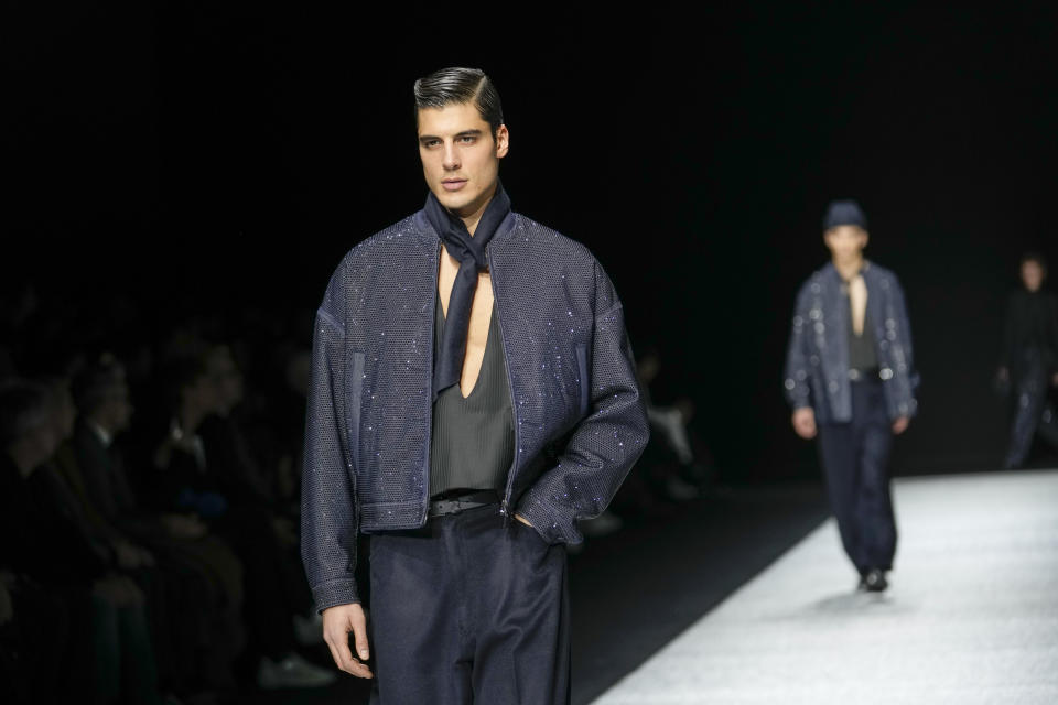 A model wears a creation as part of the men's Giorgio Armani Fall-Winter 2024-2025 collection, that was presented in Milan, Italy, Saturday, Jan. 13, 2024. (AP Photo/Luca Bruno).