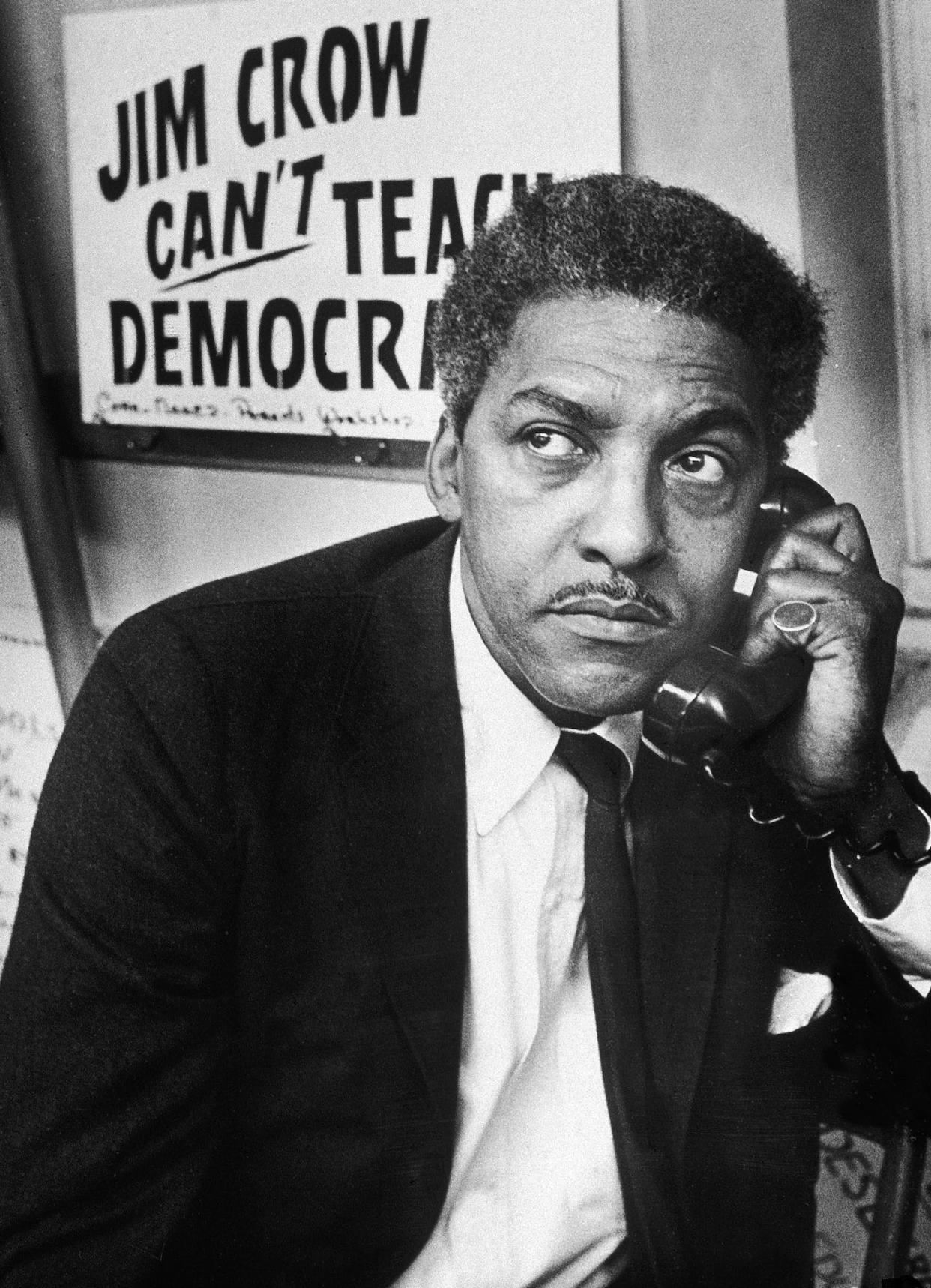 In this Feb. 2, 1964, image, Bayard Rustin talks on a telephone from a church in Brooklyn, New York. <a href="https://www.gettyimages.com/detail/news-photo/civil-rights-activist-bayard-rustin-spokesman-for-the-news-photo/3248636?phrase=bayard%20rustin&adppopup=true" rel="nofollow noopener" target="_blank" data-ylk="slk:Patrick A. Burns/New York Times Co./Getty Images;elm:context_link;itc:0;sec:content-canvas" class="link ">Patrick A. Burns/New York Times Co./Getty Images</a>