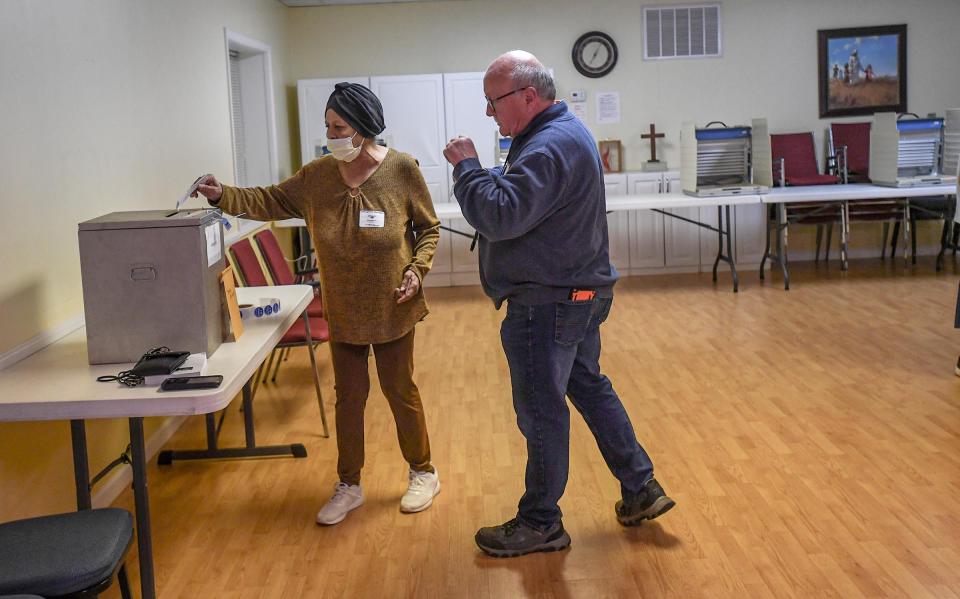 Judy Powell votes near poll clerk John Elsea, during Anderson city elections at Trinity United Methodist Church precinct, Anderson 6/1 in Anderson, S.C. Monday, April 2, 2024.