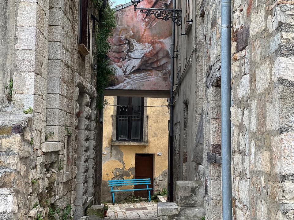 Street art can be found hidden in alleys, arches and doorways across Civitacampomarano, Italy.